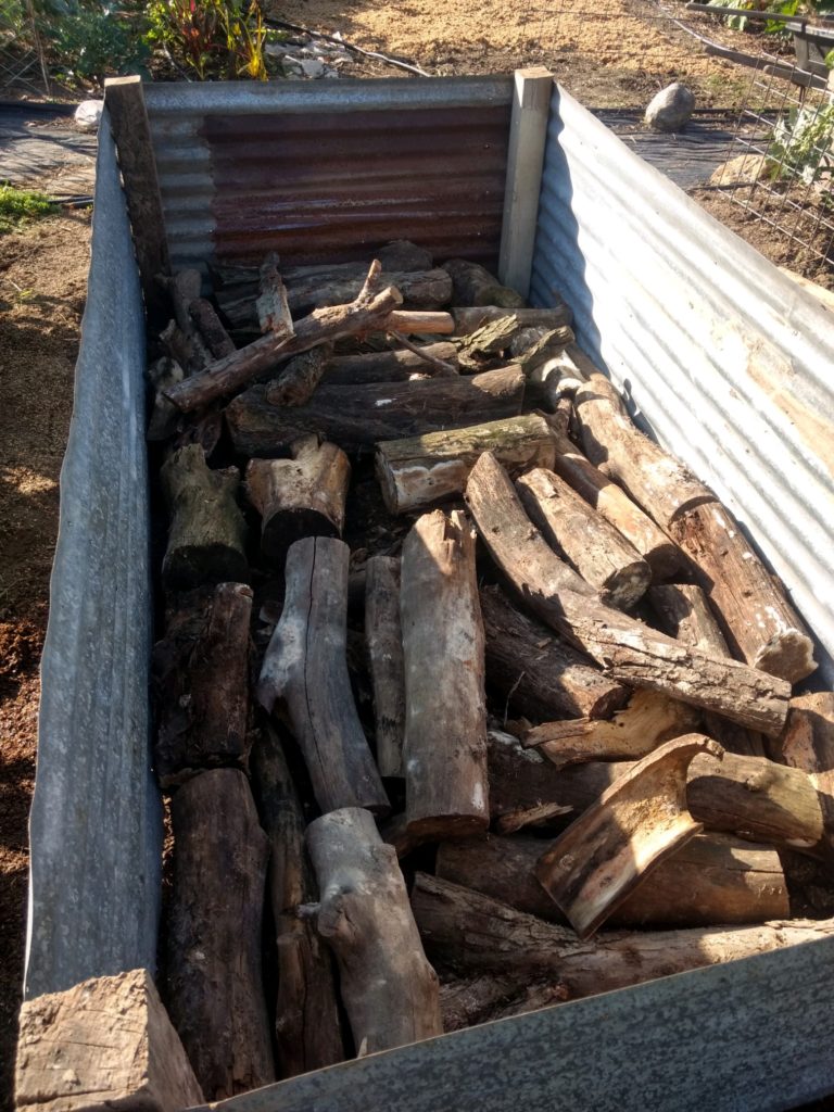 putting logs in raised garden beds