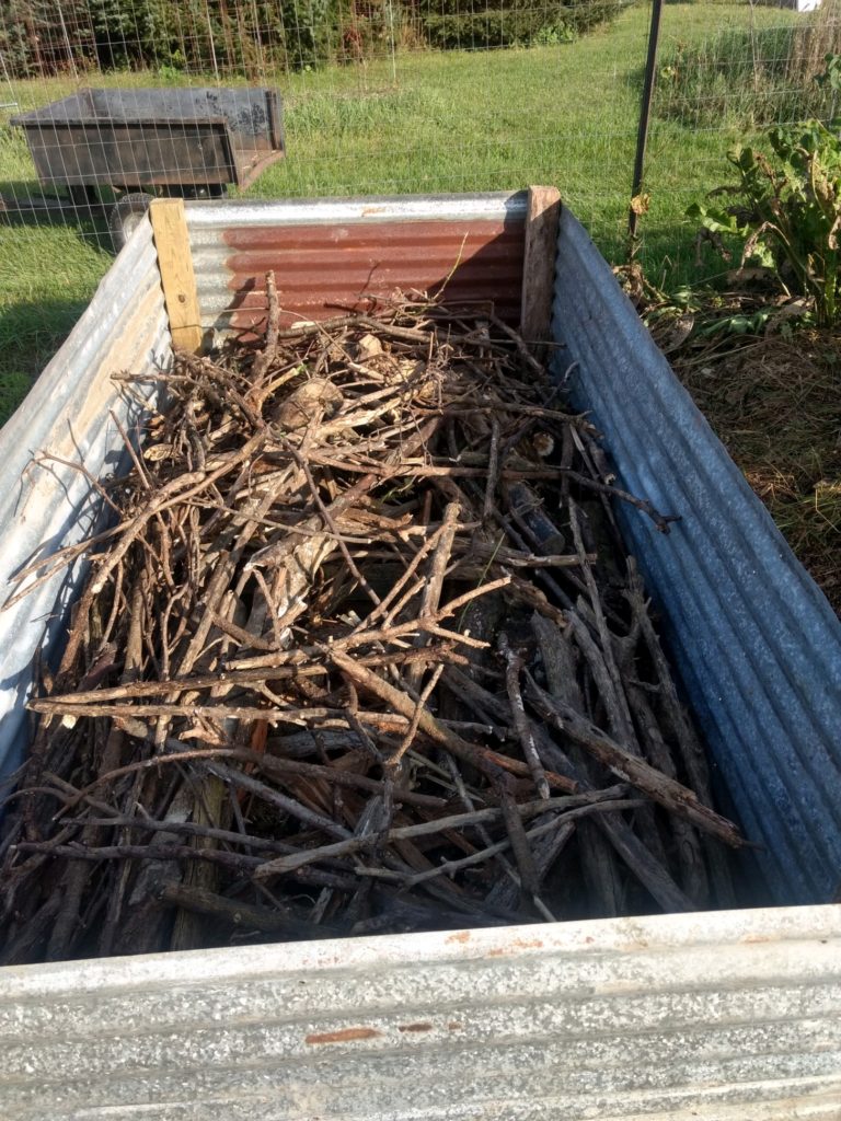 putting logs in raised garden beds